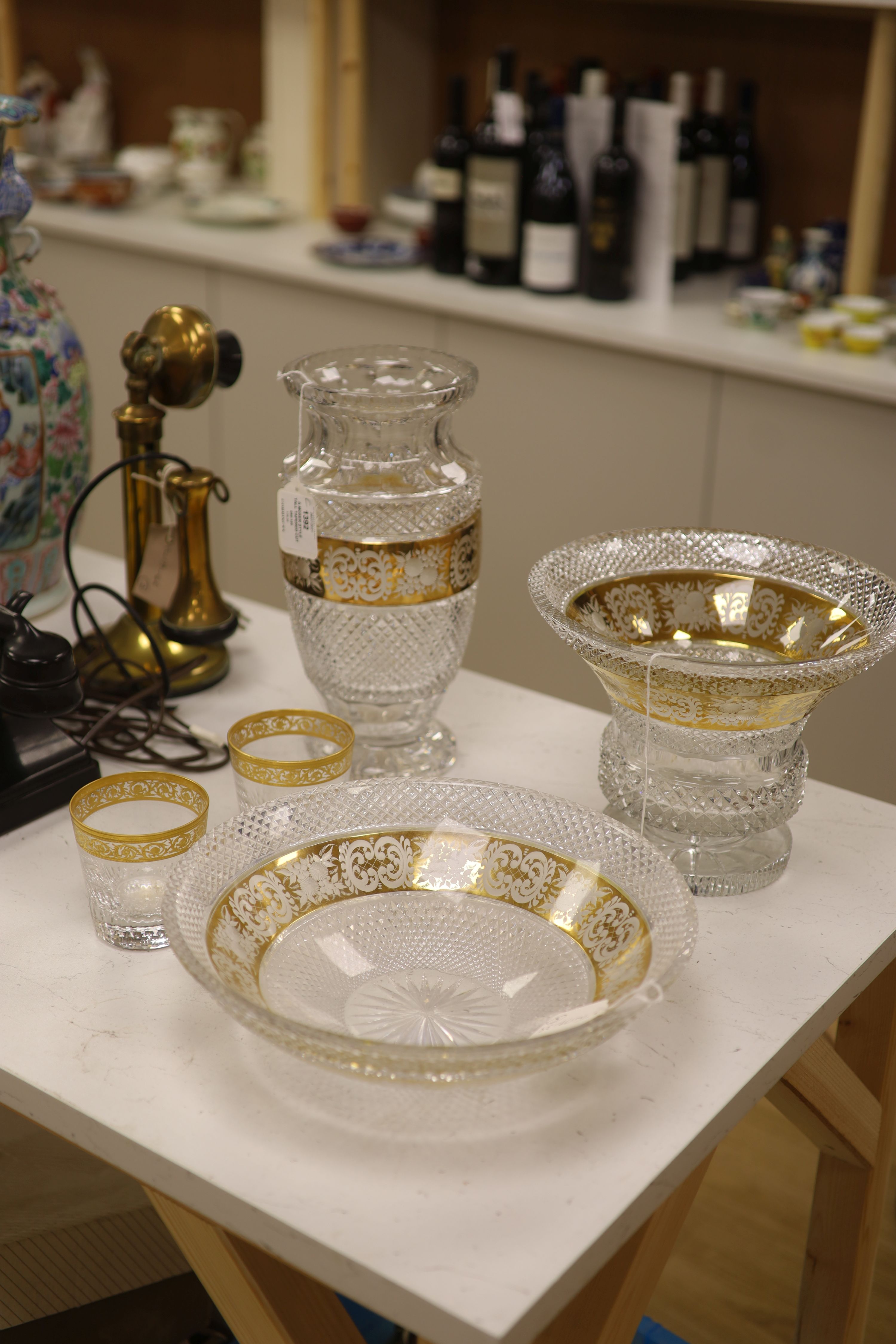 A Moser style tall tapered cut glass vase heightened in gilt, a similar circular bowl, a pedestal bowl and two St Louis tumblers